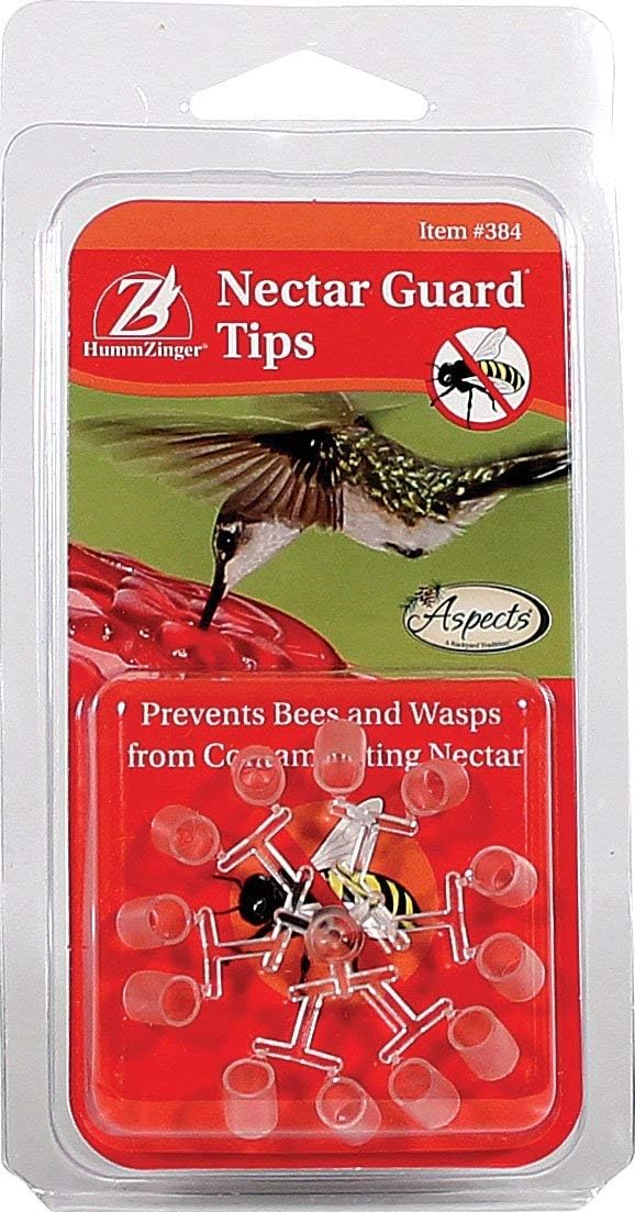 Bee guards fitted over hummingbird feeder ports